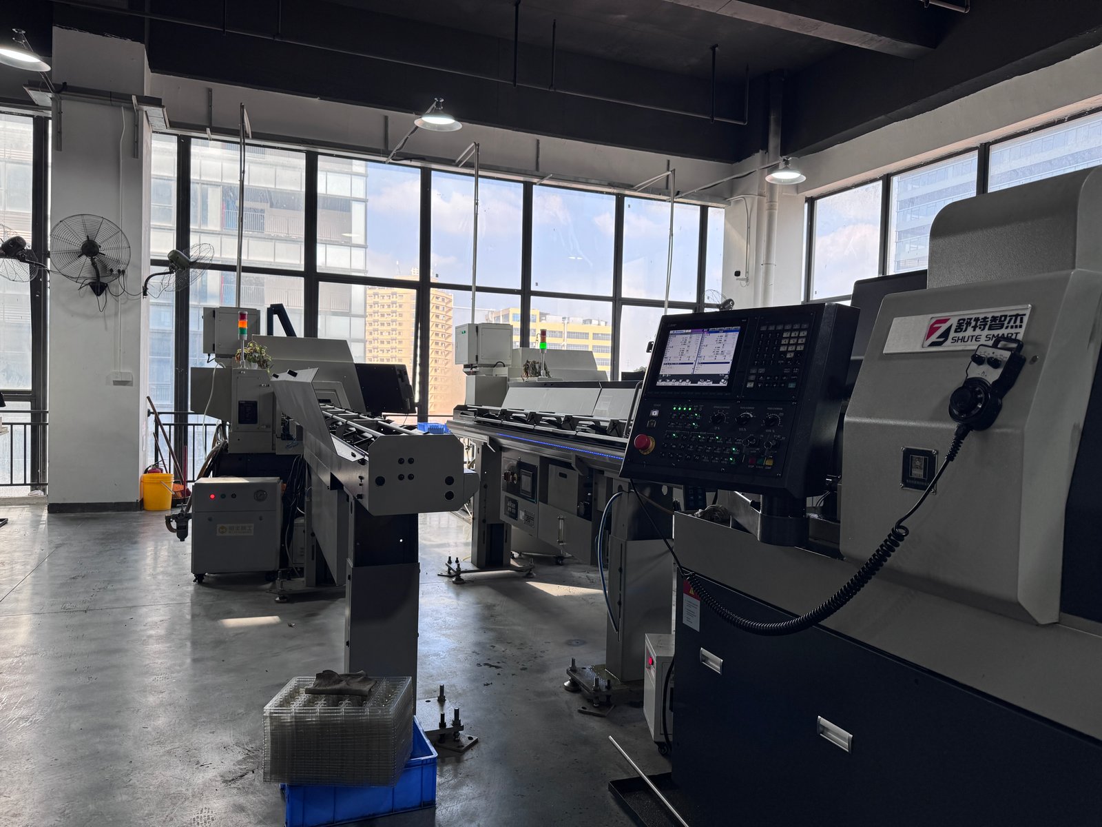 Precision turned metal parts and shaft components displayed in an industrial setting