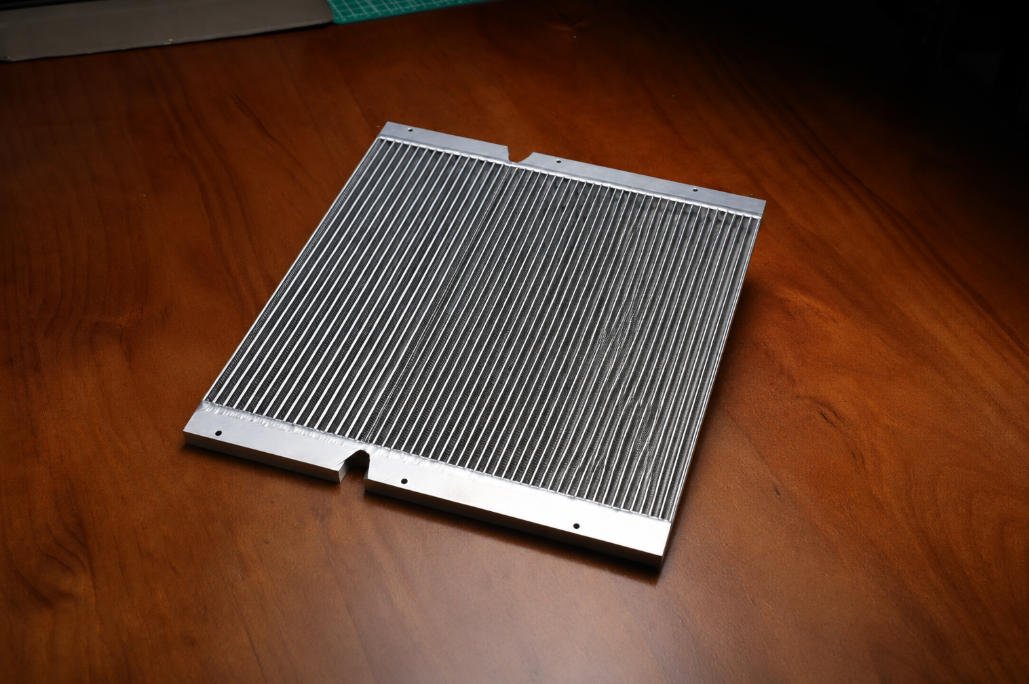 Aluminum heat sink thermal component on wooden table
