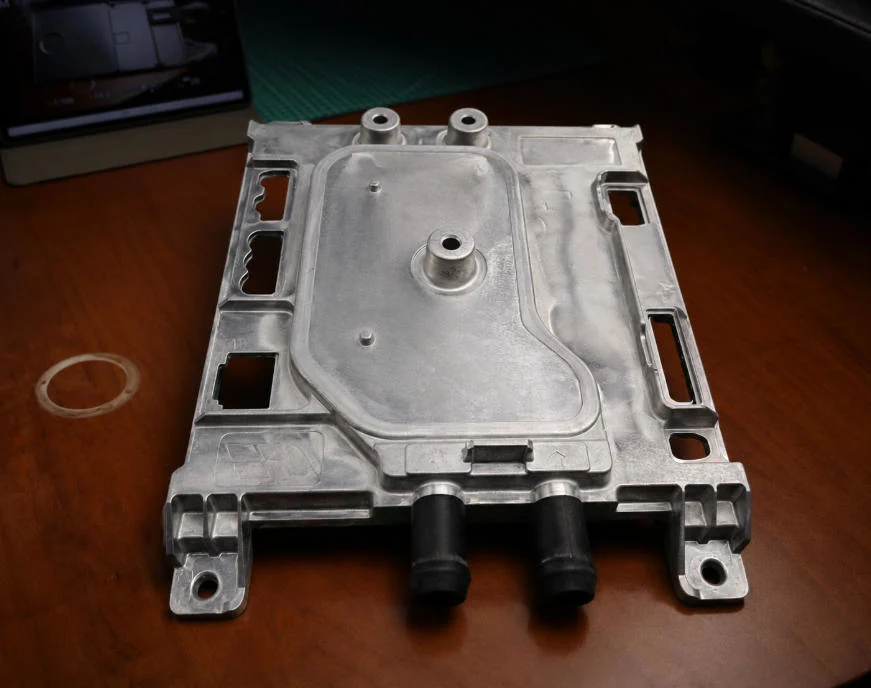 Magnesium die casting electronics structure component for lightweight OEM enclosure applications