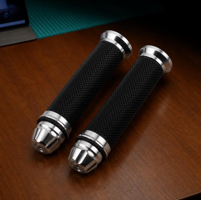 Rubber over metal overmolded handle components for industrial grip applications